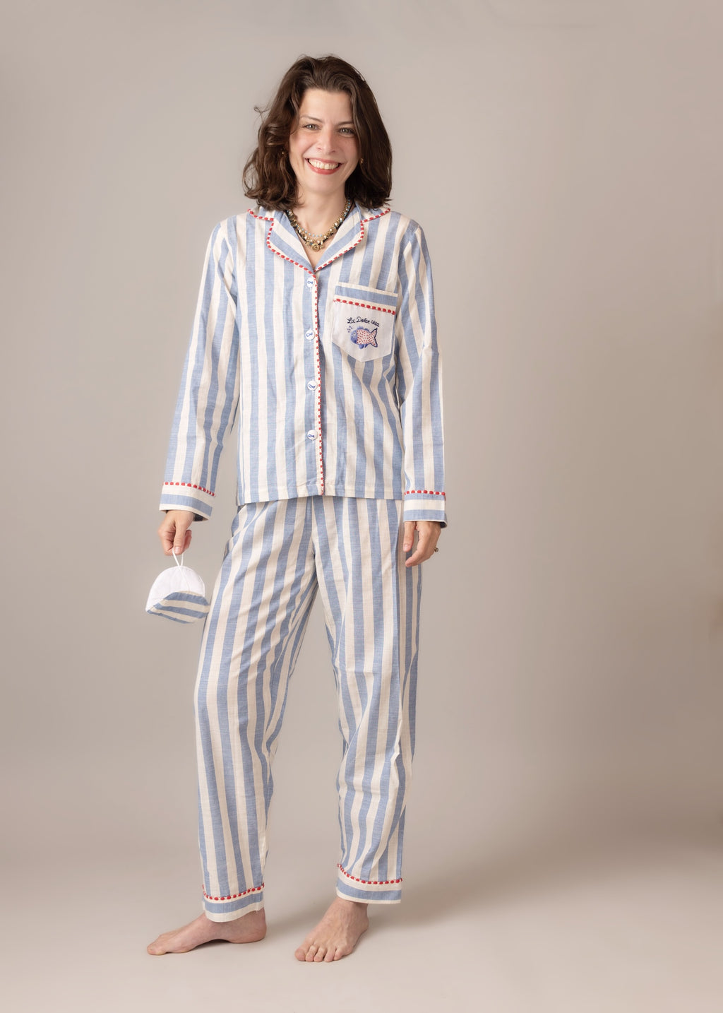 Woman wearing a  blue striped pajama set  cotton poplin 