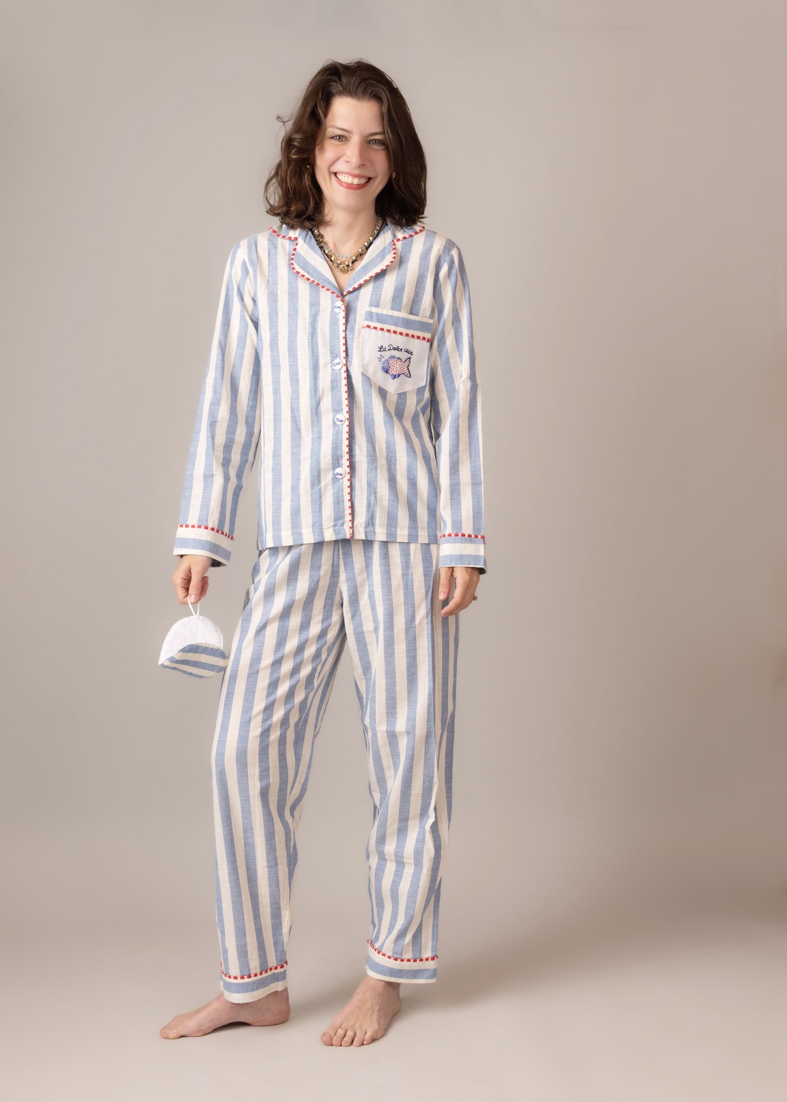 Woman wearing a  blue striped pajama set  cotton poplin 